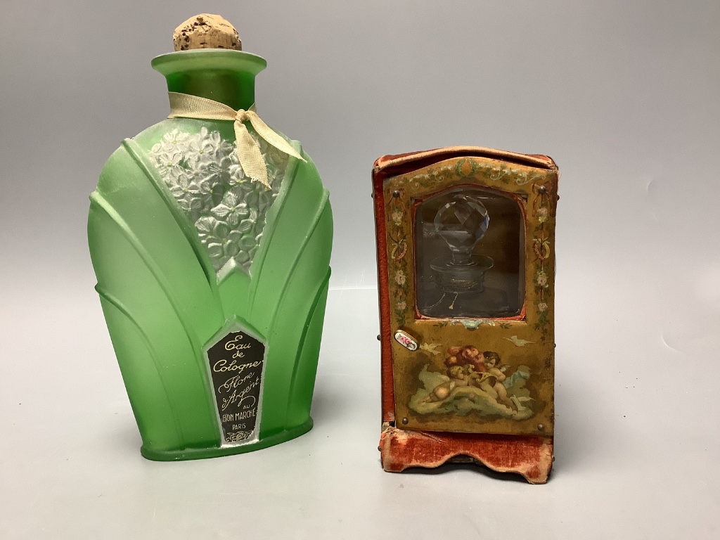 A papier mache and velvet ‘sedan chair’ scent bottle case, associated bottle and a Flore d’Argent eau de cologne bottle